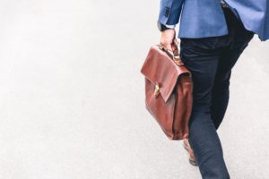 private lenders walking holding briefcase